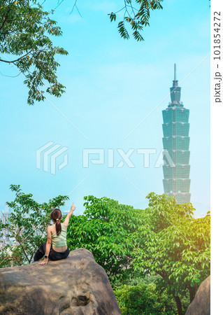 woman traveler visiting in Taiwan, Tourist looking Taipei City during sightseeing and hiking at Elephant Mountain or Xiangshan, landmark and popular attractions. Asia Travel, vacation and Trip concept 101854272