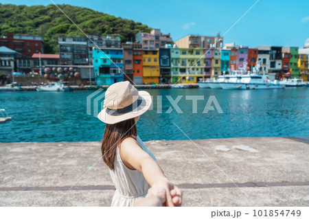 Couple traveler visiting in Taiwan, Tourist sightseeing in Keelung, Colorful Zhengbin Fishing Port, landmark and popular attractions near Taipei city. trip, love, together and summer vacation concept 101854749