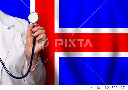 Icelandic doctor's hand with stethoscope on the background of flag of Iceland Medicine Icelandic doctor's hand with stethoscope on the background of flag of Iceland Medicine 101855107