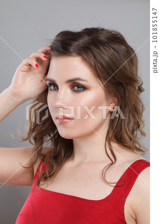 Cute woman with makeup and wavy hairstyle, beautiful face closeup Cute woman with makeup and wavy hairstyle, beautiful face closeup 101855147