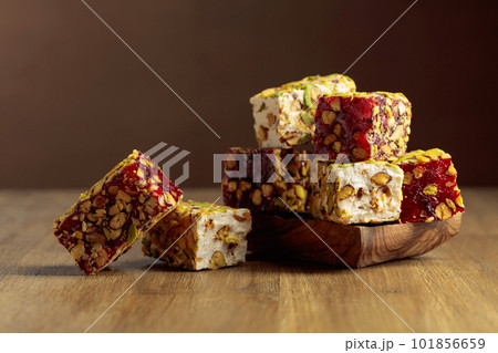 Traditional Turkish delight on a wooden table. Traditional Turkish delight on a wooden table. 101856659