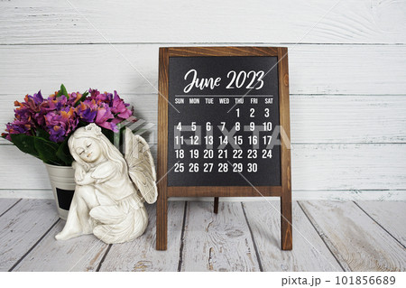 June 2023 monthly calendar on easel stand on wooden background June 2023 monthly calendar on easel stand on wooden background 101856689