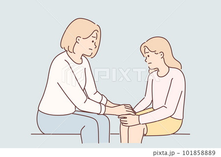 Mom holds hand of sad teenager daughter helps to get rid stress and consoles after quarrel 101858889