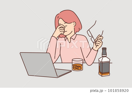 Businesswoman drinks whiskey sitting near laptop and feeling stressed after company goes bankrupt Businesswoman drinks whiskey sitting near laptop and feeling stressed after company goes bankrupt 101858920