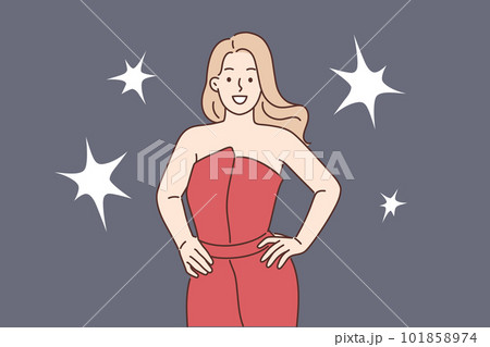 Celebrity woman poses for reporters standing in evening dress during film festival or award ceremony 101858974