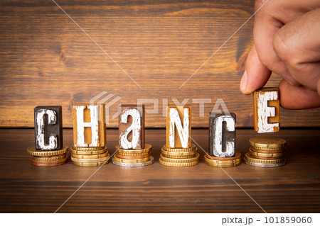 CHANCE. Word from alphabet blocks and change on wood texture background 101859060