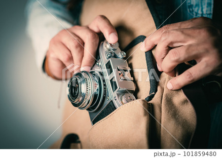 Retro camera in hand 101859480