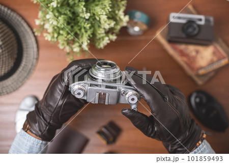 vintage camera in photographer's hand vintage camera in photographer's hand 101859493