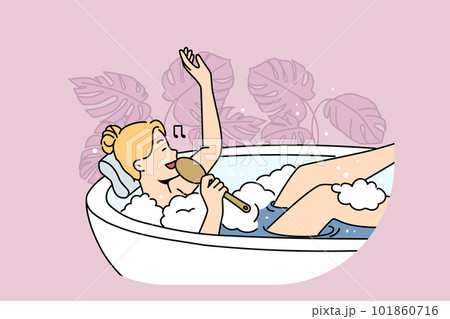 Woman lying in bathtub singing  101860716