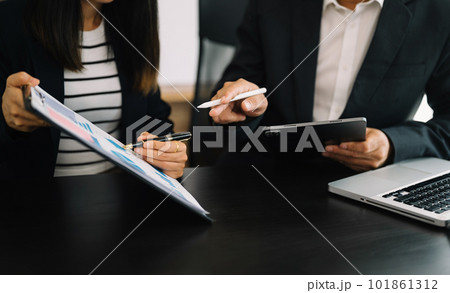 Business team meeting present.professional investor working with Finance managers task. with digital tablet,smartphone and laptop at office Business team meeting present.professional investor working with Finance managers task. with digital tablet,smartphone and laptop at office 101861312