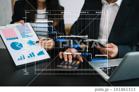 Project manager working and update tasks with milestones progress planning and Gantt chart scheduling diagram.business tram working at office. 101861313