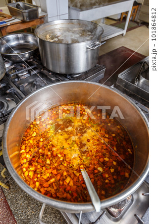 Several pots cooking on hotplate Several pots cooking on hotplate 101864812