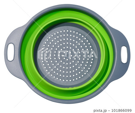 Plastic green collapsible colander on white isolated background 101866099