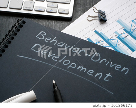 Desk with notepad and marks about behavior driven development BDD. Desk with notepad and marks about behavior driven development BDD. 101866175