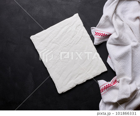 Empty white ceramic plate on black background, top view 101866331