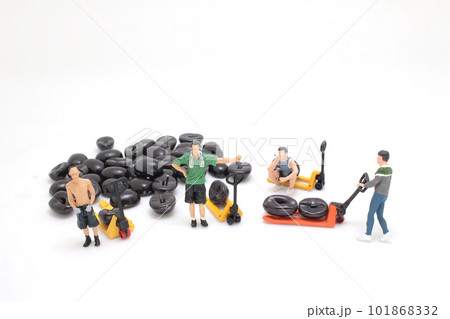 a worker using pallet jack to lift heavy roasted coffee bean 101868332