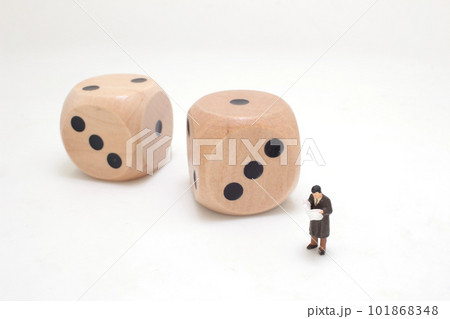 the Businessman reading book with dice. Education and business Concept. the Businessman reading book with dice. Education and business Concept. 101868348