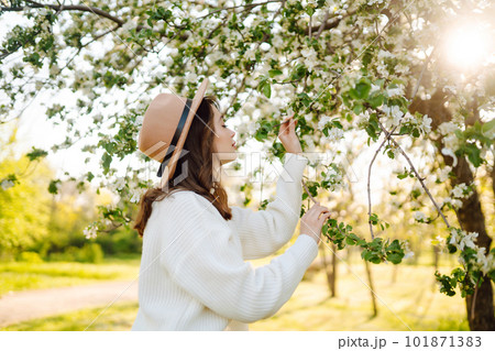 Beautiful young woman near blooming spring tree. Youth, love, fashion, romantic, lifestyle concept. Beautiful young woman near blooming spring tree. Youth, love, fashion, romantic, lifestyle concept. 101871383