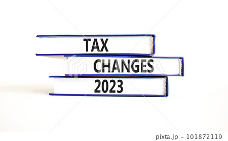 Tax changes 2023 symbol. Concept words Tax changes 2023 on books on a beautiful white table white background. Business Tax changes 2023 concept. Copy space. Tax changes 2023 symbol. Concept words Tax changes 2023 on books on a beautiful white table white background. Business Tax changes 2023 concept. Copy space. 101872119