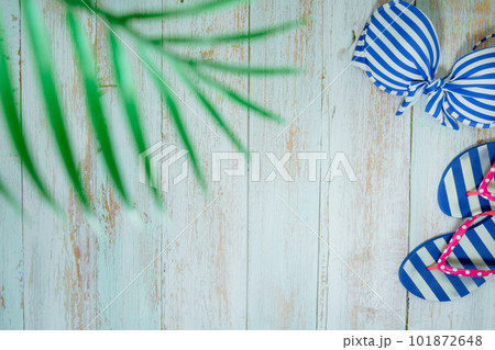web banner and flat lay summer time with swimsuit and beach accessories on vintage blue wooden background web banner and flat lay summer time with swimsuit and beach accessories on vintage blue wooden background 101872648