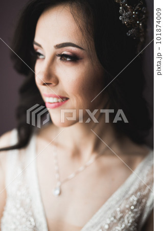 Beautiful fashion bride in wedding dress posing Beautiful fashion bride in wedding dress posing 101874009