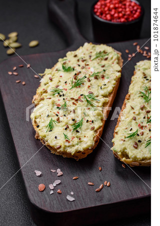 Grilled toast with avocado paste, eggs, cream cheese, salt, spices and herbs Grilled toast with avocado paste, eggs, cream cheese, salt, spices and herbs 101874644