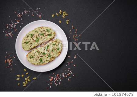 Grilled toast with avocado paste, eggs, cream cheese, salt, spices and herbs Grilled toast with avocado paste, eggs, cream cheese, salt, spices and herbs 101874678