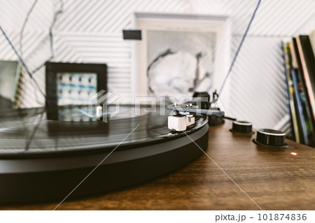 Vinyl record player, bright lights disco-bokeh. Needle on vinyl record. 101874836