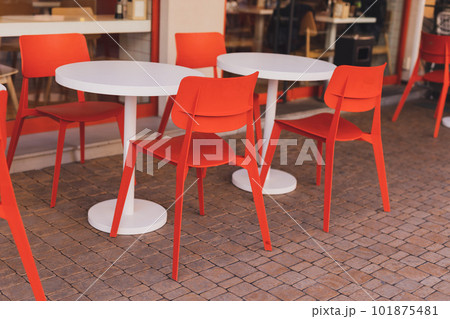 Empty cafe terrace with tables and chairs. Exterior of cafe restaurant. Interior cozy Street cafe . Decor facade of urban coffee house. 101875481