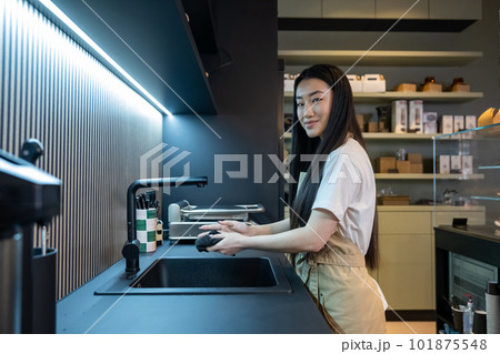 Cafe employee posing for the camera in the working place 101875548