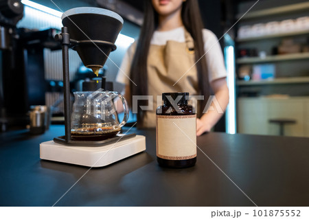 Bartender making a drink at the bar counter 101875552