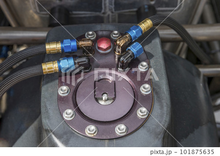 The fuel cap and connecting hoses on a speedway racing car The fuel cap and connecting hoses on a speedway racing car 101875635