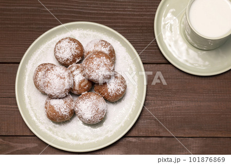 Fat Thursday Carnival or Tlusty Czwartek, Christian tradition. Top View Of Zeppole Or Paczki On Plate With Powdered Sugar, Cup Of Milk On Wooden Table. Doughnut, Delicious Donuts. Horizontal Plane Fat Thursday Carnival or Tlusty Czwartek, Christian tradition. Top View Of Zeppole Or Paczki On Plate With Powdered Sugar, Cup Of Milk On Wooden Table. Doughnut, Delicious Donuts. Horizontal Plane 101876869