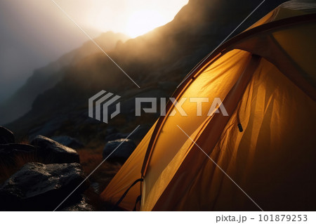 A stunning alpine landscape with a tent pitched in the foreground, providing the perfect backdrop for camping, hiking, and wilderness exploration. AI Generative. 101879253