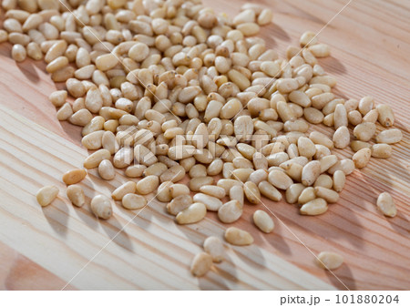Picture of raw pine nut on the wooden desk, nobody 101880204