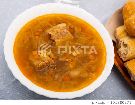 Soup of cabbage with boiled vegetables, pork broth and sour cream 101880273