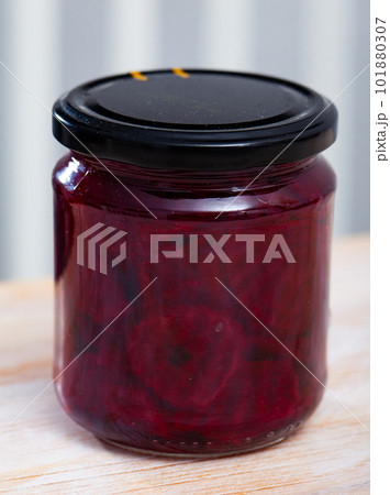 Glass jar with pickled red beets 101880307