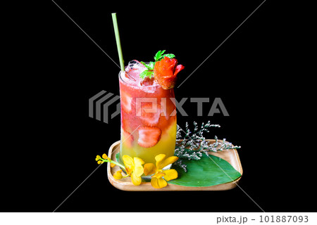 Fresh summer drink with strawberry jam and orange juice isolated on black background 101887093