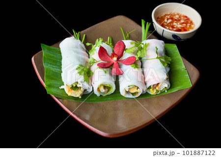 Vietnamese Pho spring roll with seafood, tofu, vegetables isolated on black background for a menu Vietnamese Pho spring roll with seafood, tofu, vegetables isolated on black background for a menu 101887122