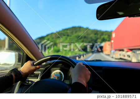 People driving car into a tunnel 101889571