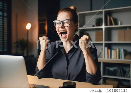 Excited businesswoman celebrating success in office. Successful businesswoman in eyeglasses sitting at table with laptop and raising hands up. Generative AI 101892133