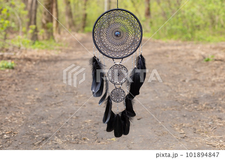 Handmade dream catcher with feathers threads and beads rope hanging 101894847