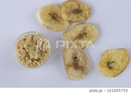 Gluten-free dried banana flour on white background 101895759