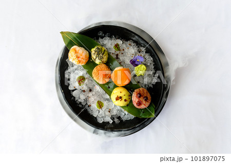 Temari sushi on a black plate with ice 101897075