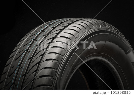 Tire close-up on a black background, side view 101898836