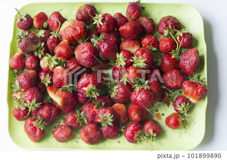 A lot of strawberries in a plate top view.Red berry in a rectangular container 101899890