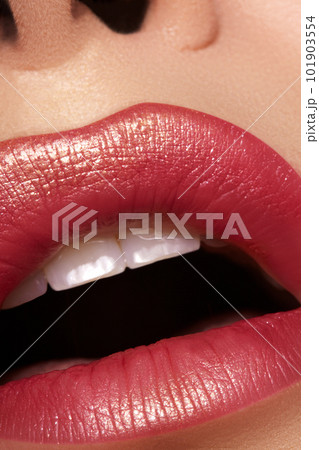 Glamour fashion bright red lips make-up with gold glitter. Macro of woman's face part. Sexy lip makeup, luxury visage Glamour fashion bright red lips make-up with gold glitter. Macro of woman's face part. Sexy lip makeup, luxury visage 101903554
