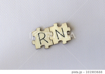 The acronym RN, which stands for Right Now. The letters written on the puzzles. The acronym RN, which stands for Right Now. The letters written on the puzzles. 101903688