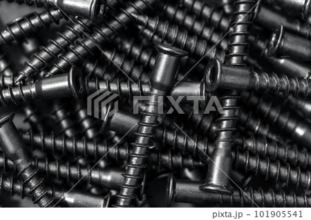 Assembly wood screws background texture. Black color. Full frame 101905541