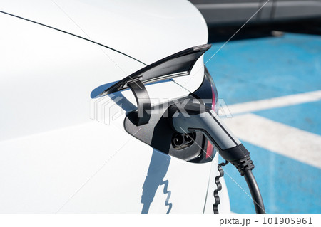 Charging station for a car close-up. Green energy, environmentally friendly car. Charging station for a car close-up. Green energy, environmentally friendly car. 101905961